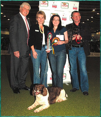 Judge Peter Purves with Kennel Club Chief Executive Rosemary Smart, winner Paula Cogan and John Burns